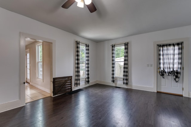 216 N St, Utica, OH 43080 - foyer entrance with ceiling fan, wood finished floors, and baseboards