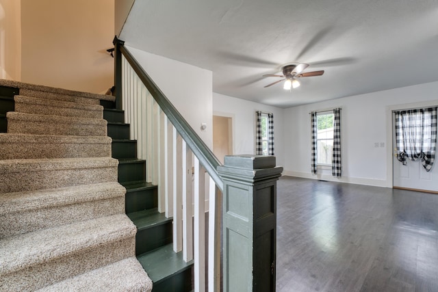216 N St, Utica, OH 43080 - stairs featuring a ceiling fan, wood finished floors, and baseboards