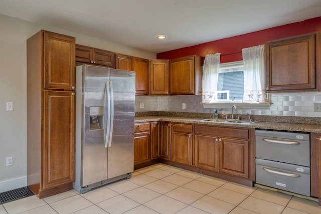 216 N St, Utica, OH 43080 - kitchen featuring stainless steel refrigerator with ice dispenser, a sink, brown cabinets, and recessed lighting