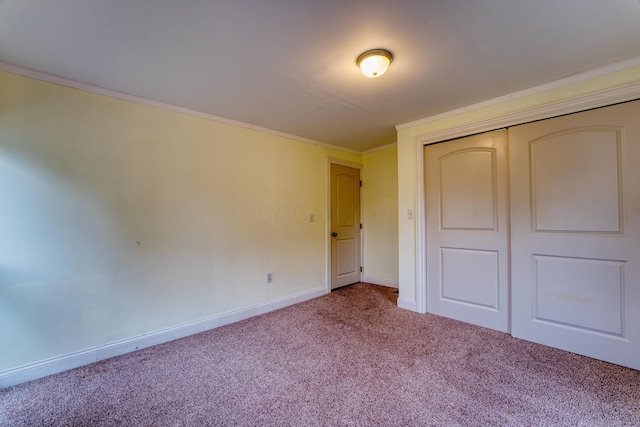 216 N St, Utica, OH 43080 - unfurnished bedroom featuring carpet, ornamental molding, baseboards, and a closet