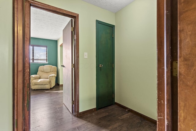 5722 Jousting Ln Unit B, Columbus, OH 43231 - corridor with a textured ceiling, dark wood-style flooring, and baseboards