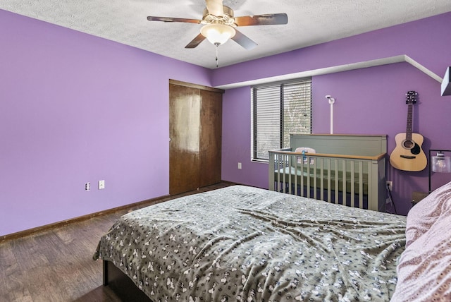 5722 Jousting Ln Unit B, Columbus, OH 43231 - bedroom with a textured ceiling, baseboards, wood finished floors, and a ceiling fan