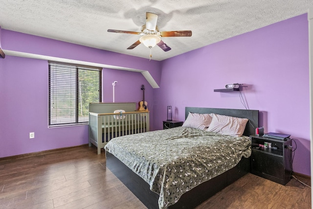 5722 Jousting Ln Unit B, Columbus, OH 43231 - bedroom with wood finished floors, a textured ceiling, and ceiling fan
