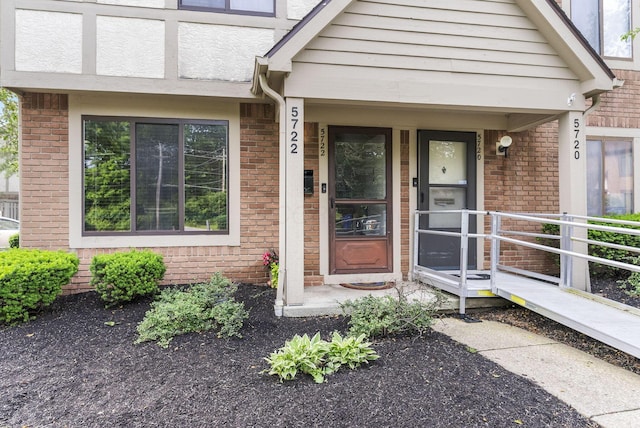 5722 Jousting Ln Unit B, Columbus, OH 43231 - view of exterior entry featuring brick siding and covered porch