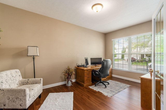 5673 Sugarwood Dr, New Albany, OH 43054 - home office with baseboards and dark wood finished floors