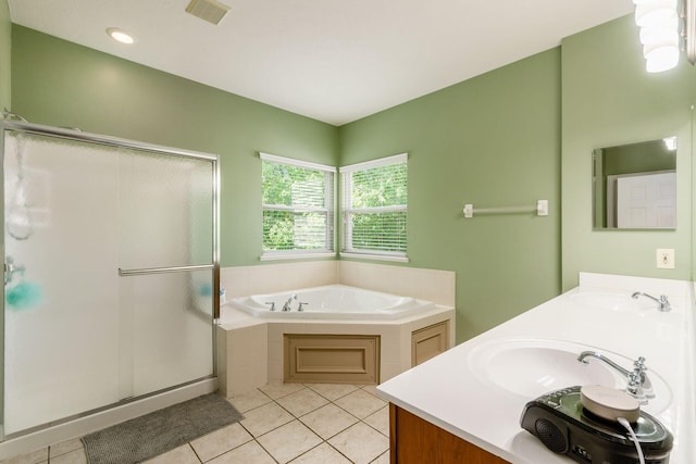 5673 Sugarwood Dr, New Albany, OH 43054 - bathroom with tile patterned floors, a stall shower, a garden tub, and double vanity