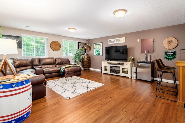 5673 Sugarwood Dr, New Albany, OH 43054 - living room with wood finished floors and baseboards