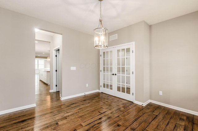7839 Eastcross Dr, New Albany, OH 43054 - empty room with wood finished floors, a chandelier, french doors, and baseboards