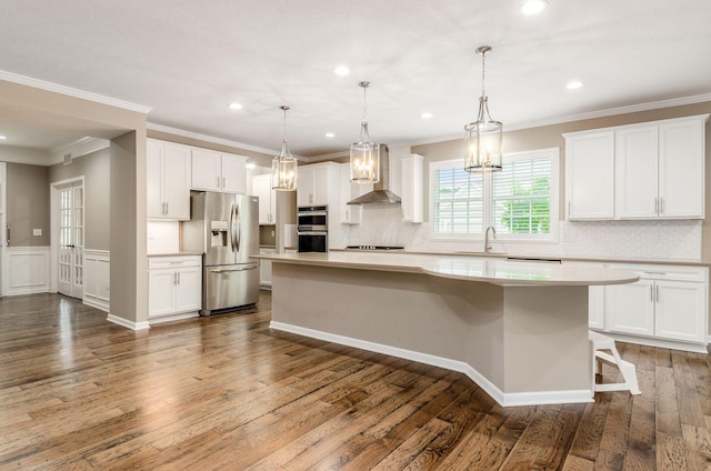 7839 Eastcross Dr, New Albany, OH 43054 - kitchen with appliances with stainless steel finishes, a center island, light countertops, white cabinetry, and recessed lighting