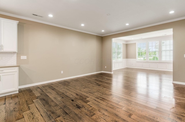 7839 Eastcross Dr, New Albany, OH 43054 - empty room featuring wood finished floors, ornamental molding, and recessed lighting