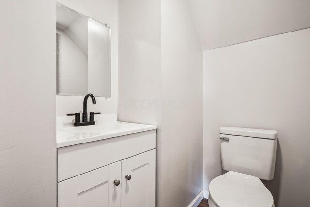 1598 Harvard Ave, Columbus, OH 43203 - half bath with vanity, toilet, and lofted ceiling