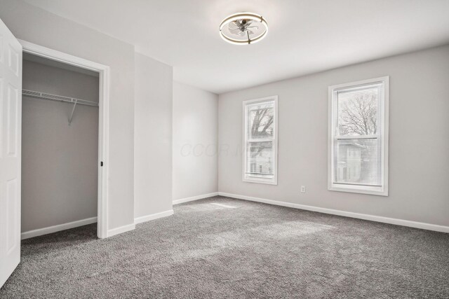 1598 Harvard Ave, Columbus, OH 43203 - unfurnished bedroom with carpet floors, baseboards, and a closet