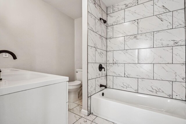 1598 Harvard Ave, Columbus, OH 43203 - bathroom with marble look tiles, toilet, shower / washtub combination, and vanity