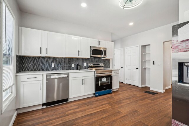 1598 Harvard Ave, Columbus, OH 43203 - kitchen featuring appliances with stainless steel finishes, backsplash, healthy amount of natural light, and recessed lighting