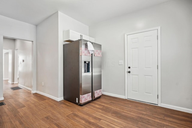 1598 Harvard Ave, Columbus, OH 43203 - kitchen featuring stainless steel fridge, wood finished floors, white cabinetry, and baseboards