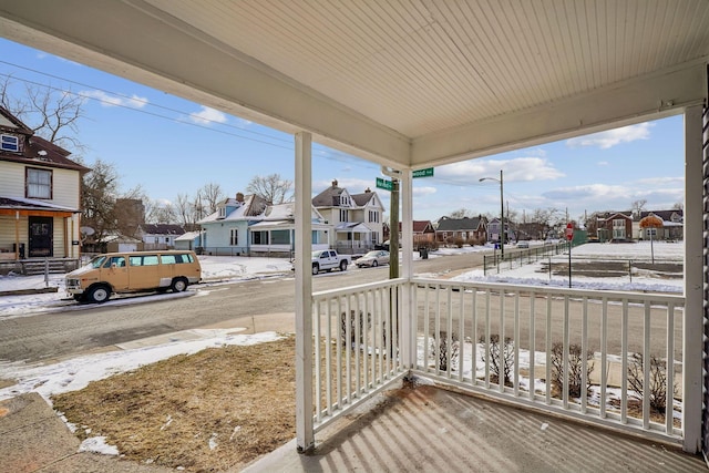 1598 Harvard Ave, Columbus, OH 43203 - snow covered deck featuring a residential view and a porch