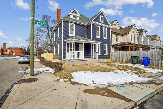 1598 Harvard Ave, Columbus, OH 43203 - view of front of house with a porch, a chimney, and a residential view