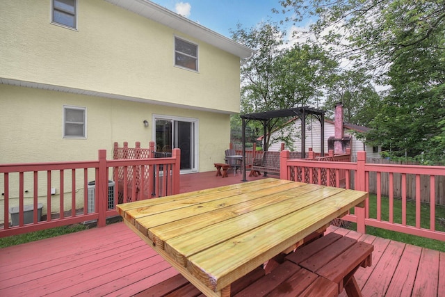 883 Mcnaughten Rd, Columbus, OH 43213 - wooden deck with outdoor dining area, a fenced backyard, and a pergola