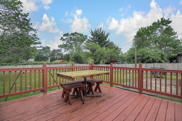883 Mcnaughten Rd, Columbus, OH 43213 - deck featuring outdoor dining space, a fenced backyard, and a storage unit