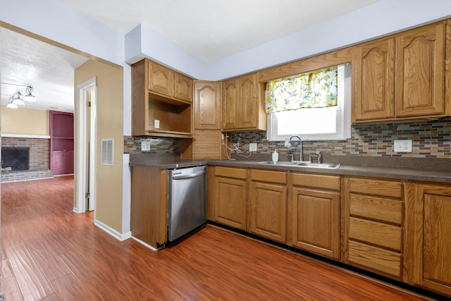 883 Mcnaughten Rd, Columbus, OH 43213 - kitchen featuring dishwasher, decorative backsplash, and brown cabinetry