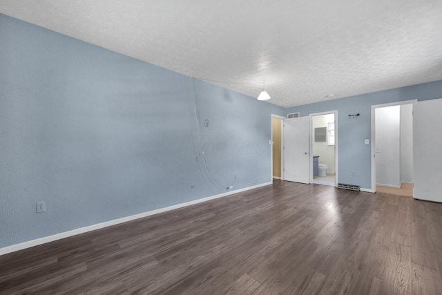 883 Mcnaughten Rd, Columbus, OH 43213 - empty room featuring dark wood finished floors and baseboards