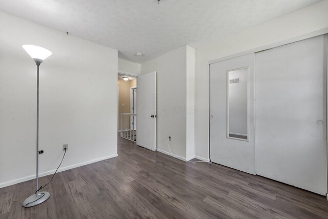 883 Mcnaughten Rd, Columbus, OH 43213 - unfurnished bedroom featuring wood finished floors and a closet