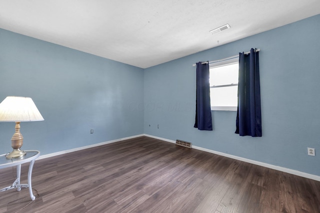 883 Mcnaughten Rd, Columbus, OH 43213 - empty room with dark wood-style floors and baseboards