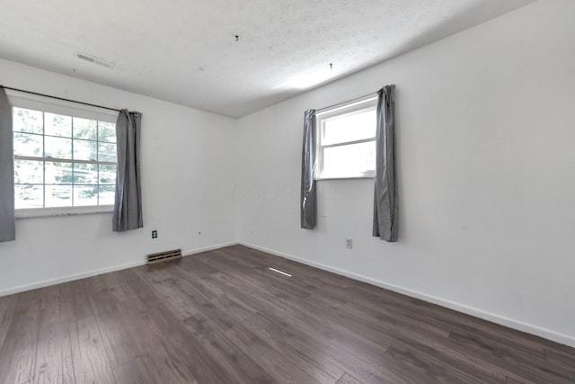 883 Mcnaughten Rd, Columbus, OH 43213 - unfurnished room with dark wood-type flooring and plenty of natural light