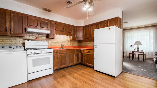 524 Ridgefield Rd, Newark, OH 43055 - kitchen featuring white appliances, washer / clothes dryer, range hood, ceiling fan, and a sink
