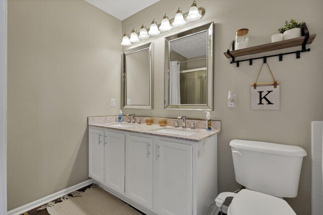 226 Purple Finch Loop, Pataskala, OH 43062 - bathroom with double vanity, toilet, curtained shower, and baseboards