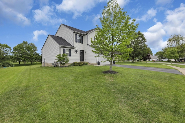 226 Purple Finch Loop, Pataskala, OH 43062 - view of front of home with asphalt driveway, a front lawn, and an attached garage