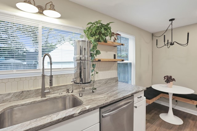 2538 Lexington Ave, Columbus, OH 43211 - kitchen with stainless steel dishwasher, a sink, white cabinets, wood finished floors, and open shelves