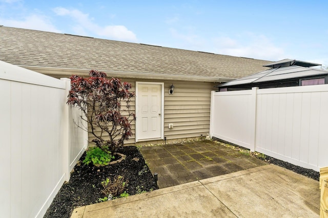5290 Berthold Pass Dr, Dublin, OH 43016 - entrance to property featuring roof with shingles and a patio area