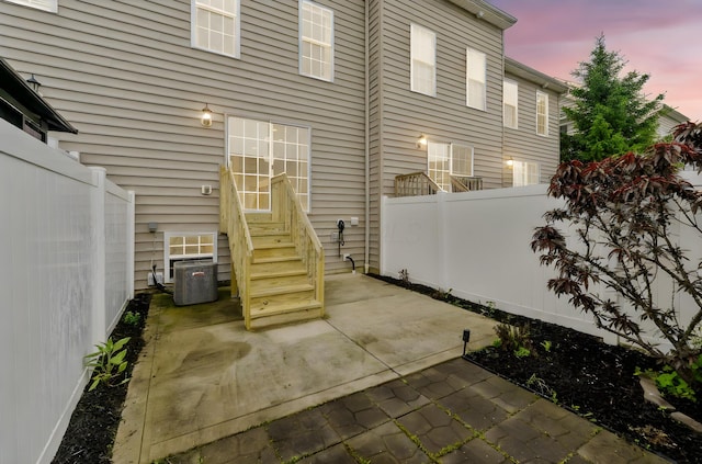 5290 Berthold Pass Dr, Dublin, OH 43016 - fenced backyard with entry steps, a patio area, and central air condition unit