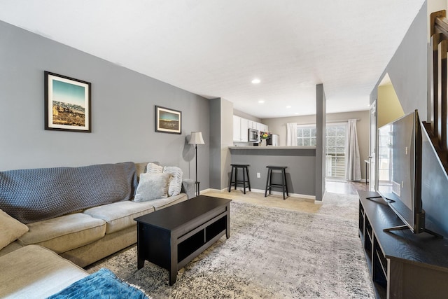 5290 Berthold Pass Dr, Dublin, OH 43016 - living area featuring light carpet, baseboards, and recessed lighting