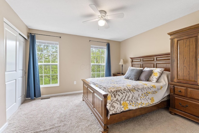 5290 Berthold Pass Dr, Dublin, OH 43016 - bedroom featuring light carpet, baseboards, ceiling fan, and a closet
