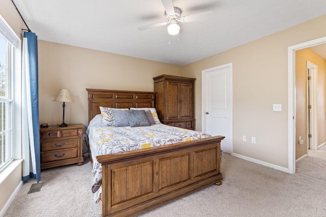 5290 Berthold Pass Dr, Dublin, OH 43016 - bedroom with light carpet, baseboards, and a ceiling fan