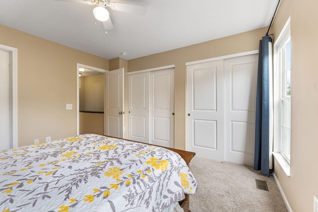 5290 Berthold Pass Dr, Dublin, OH 43016 - carpeted bedroom featuring multiple closets, multiple windows, and a ceiling fan