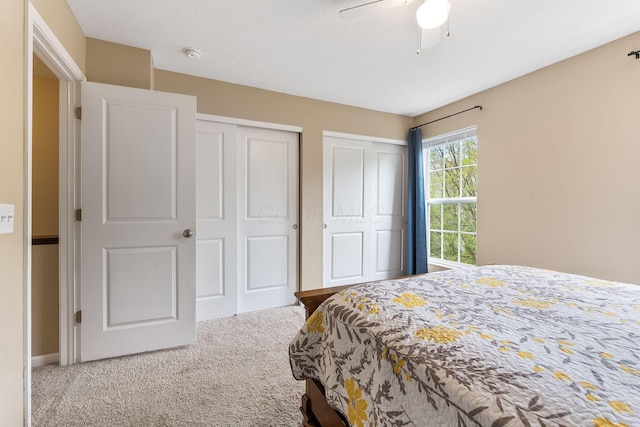 5290 Berthold Pass Dr, Dublin, OH 43016 - bedroom with carpet floors, multiple closets, and a ceiling fan