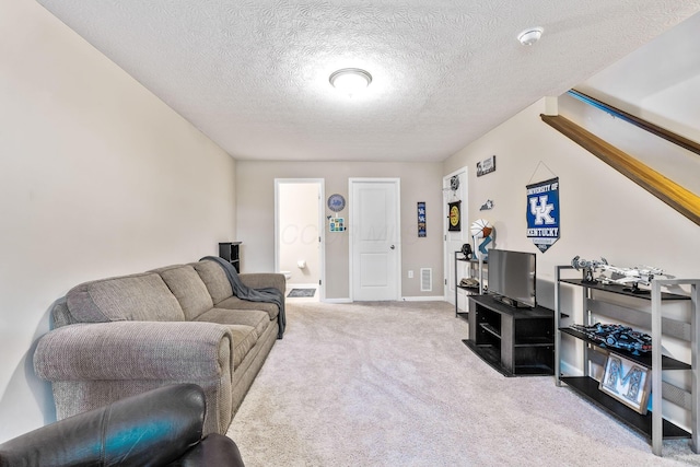 5290 Berthold Pass Dr, Dublin, OH 43016 - living room with carpet floors, a textured ceiling, and baseboards