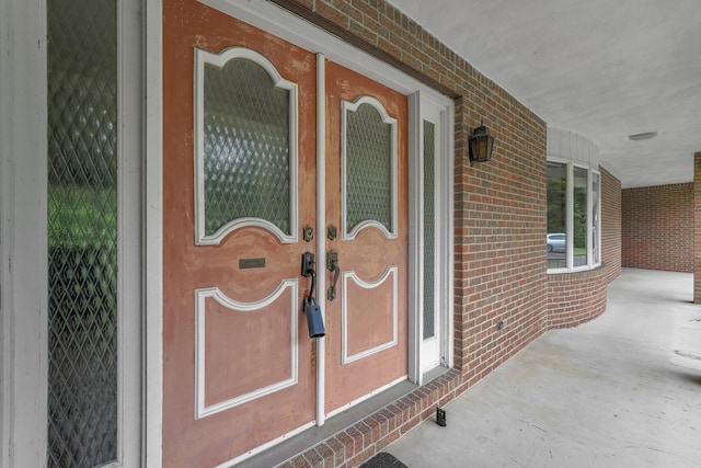 363 Carroll Eastern Rd NW, Baltimore, OH 43105 - view of exterior entry with a porch and brick siding