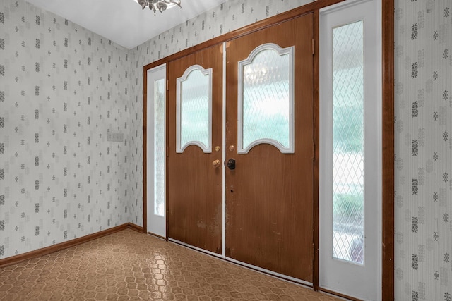 363 Carroll Eastern Rd NW, Baltimore, OH 43105 - entrance foyer featuring wallpapered walls, healthy amount of natural light, baseboards, tile patterned floors, and french doors