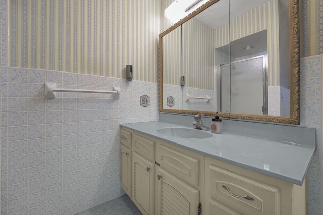 363 Carroll Eastern Rd NW, Baltimore, OH 43105 - full bath with wallpapered walls, vanity, a stall shower, a wainscoted wall, and tile walls