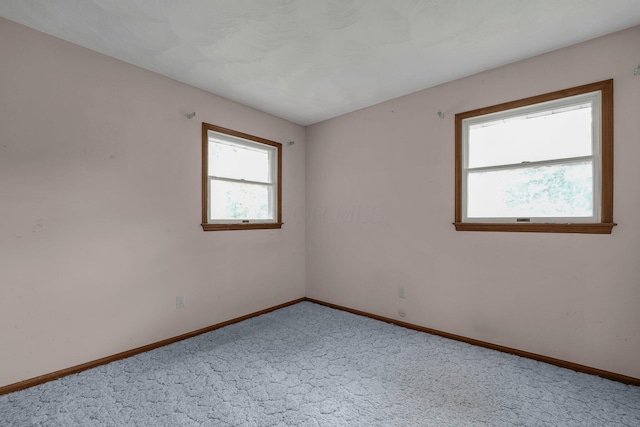 363 Carroll Eastern Rd NW, Baltimore, OH 43105 - spare room featuring carpet flooring and baseboards