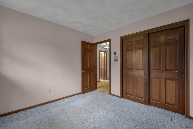 363 Carroll Eastern Rd NW, Baltimore, OH 43105 - unfurnished bedroom featuring carpet, baseboards, and a closet