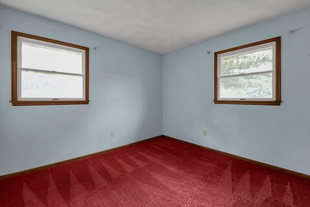 363 Carroll Eastern Rd NW, Baltimore, OH 43105 - unfurnished room with dark colored carpet and baseboards