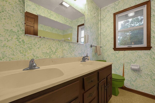 363 Carroll Eastern Rd NW, Baltimore, OH 43105 - full bathroom featuring toilet, double vanity, and baseboards