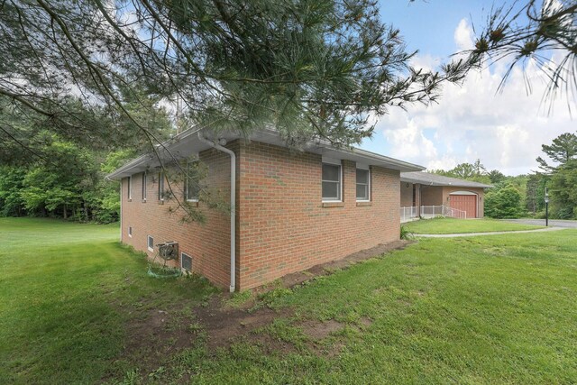 363 Carroll Eastern Rd NW, Baltimore, OH 43105 - view of property exterior with brick siding and a lawn