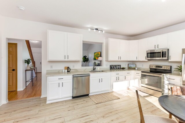 6641 Steen St, Canal Winchester, OH 43110 - kitchen with stainless steel appliances, light countertops, and white cabinets