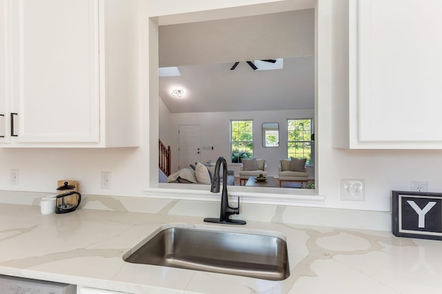 6641 Steen St, Canal Winchester, OH 43110 - kitchen with white cabinets, light stone countertops, and vaulted ceiling
